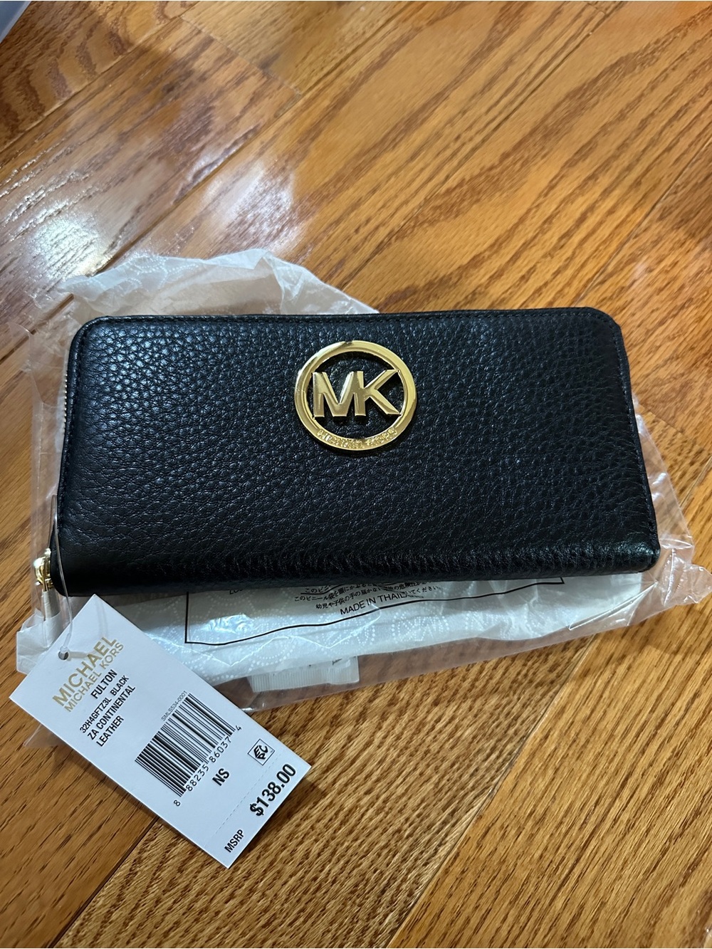 Michael Kors Black Pebbled Leather Zip Wallet with Gold MK Emblem